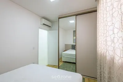 Uma cama ou camas num quarto em Apto 3 suítes 280m do mar Itapema-SC VGA1002