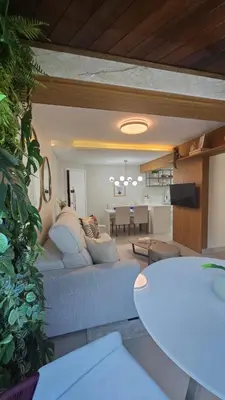 Uma televisão e/ou sistema de entretenimento em Apartamento 70m da praia em Bombinhas