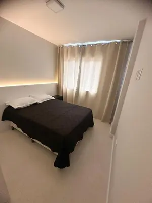 Uma cama ou camas num quarto em Turim