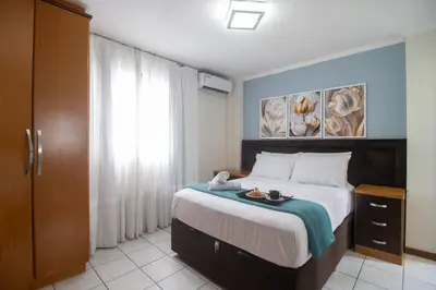 Uma cama ou camas num quarto em DCA41 - Churrasq, Garagem, 3 DR Climatizados