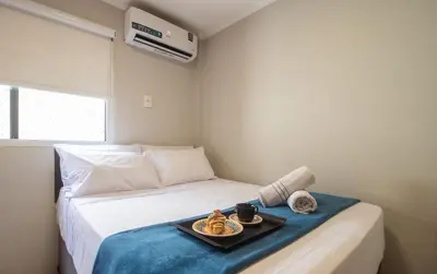 Uma cama ou camas num quarto em DCA41 - Churrasq, Garagem, 3 DR Climatizados