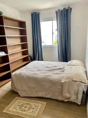 Uma cama ou camas num quarto em Apartamento inteiro 2 quartos com piscina Camboriú