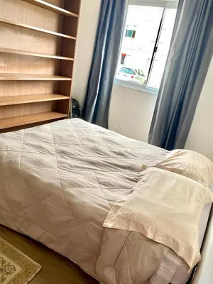 Uma cama ou camas num quarto em Apartamento inteiro 2 quartos com piscina Camboriú