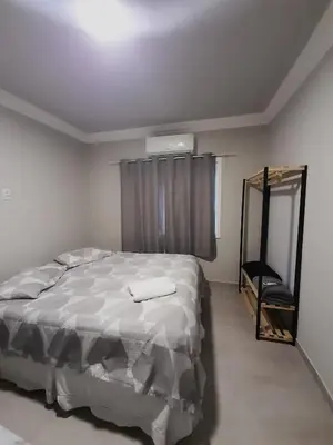 Uma cama ou camas num quarto em Leandro's Residence