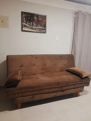 Uma área de estar em Leandro's Residence
