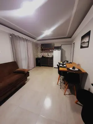Uma área de estar em Leandro's Residence