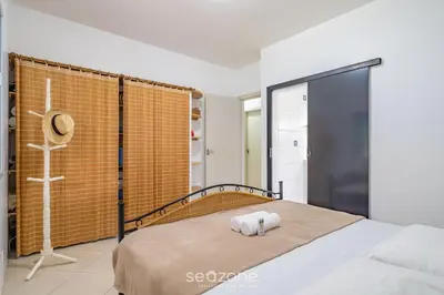 Uma cama ou camas num quarto em Casa 4Q c/ churrasq. 100m da praia JAT0355