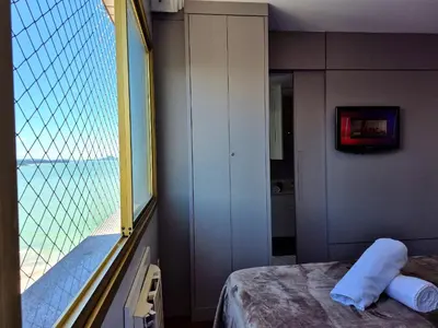 Uma cama ou camas num quarto em Vista Mar com Churrasqueira 2 Quartos |CURTA156