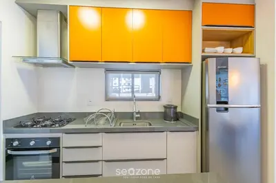 A cozinha ou kitchenette de Apto moderno a 800m da praia Itapema JZZ702