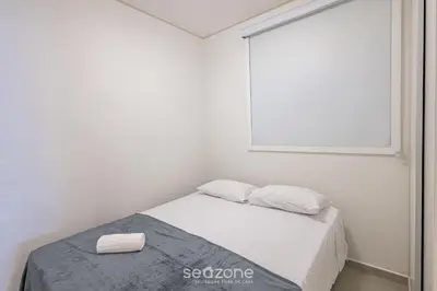 Uma cama ou camas num quarto em Apto moderno a 800m da praia Itapema JZZ702