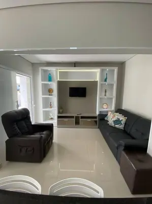 Uma televisão e/ou sistema de entretenimento em Casa com Piscina aquecida em Balneário Camboriú