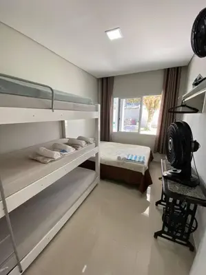 Uma cama ou camas num quarto em Casa com Piscina aquecida em Balneário Camboriú