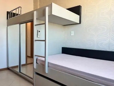 Uma cama ou camas num quarto em B251 - Apto 02 quartos em Bombas com churrasqueira
