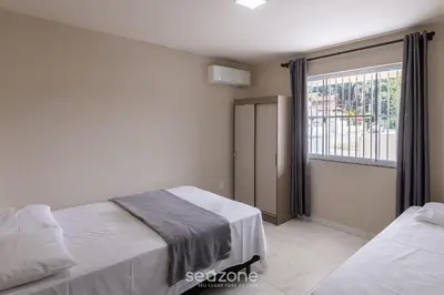Uma cama ou camas num quarto em RHE's - Casas em condomínio 2 min da praia em Bombinhas
