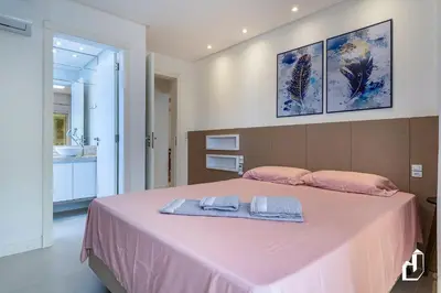Uma cama ou camas num quarto em Apartamento na quadra da praia | 02 suítes