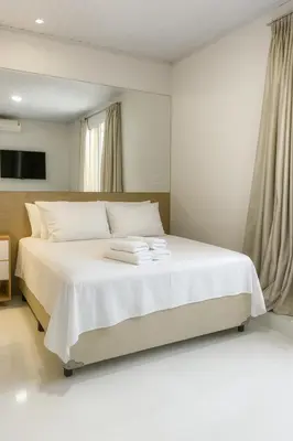 Uma cama ou camas num quarto em Hotel Pousada Litorânea