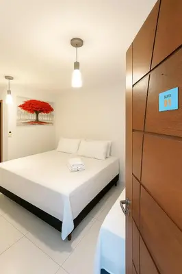 Uma cama ou camas num quarto em Hotel Pousada Litorânea
