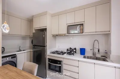 A cozinha ou kitchenette de Apto Vista Mar c/ churrasq. em Itapema SBN0705