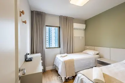 Uma cama ou camas num quarto em Apto 3Q c Vista Mar Churrasq. Garagem - BC VLD1002