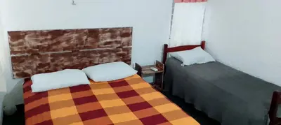 Uma cama ou camas num quarto em Residencial verde oliva