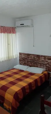 Uma cama ou camas num quarto em Residencial verde oliva