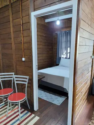 Uma cama ou camas num quarto em Casa na Praia em Porto Belo - Araçá