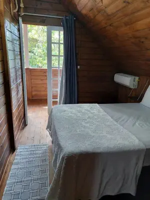 Uma cama ou camas num quarto em Casa na Praia em Porto Belo - Araçá