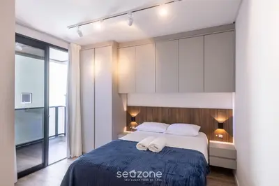 Uma cama ou camas num quarto em Apto 2Q c/ Churrasq. a 600m da Praia VRE102