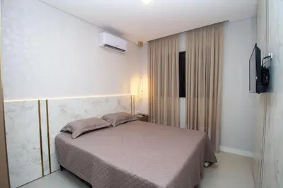Uma cama ou camas num quarto em 007A - Apartamento a poucos metros do mar