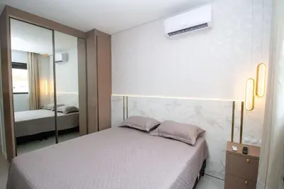 Uma cama ou camas num quarto em 007A - Apartamento a poucos metros do mar