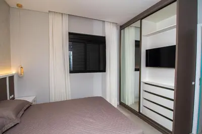 Uma cama ou camas num quarto em 007A - Apartamento a poucos metros do mar