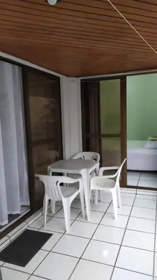 Uma cama ou camas num quarto em Apartamento na quadra do mar
