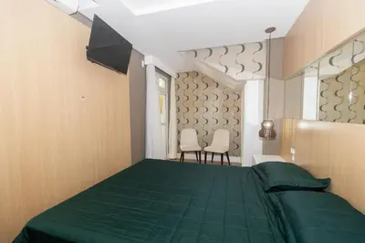 Uma cama ou camas num quarto em Varandas do Atlântico 01B – Frente Mar em Bombas