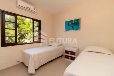 Uma cama ou camas num quarto em LINDA CASA COM PISCINA PARA ALUGUEL DE TEMPORADA EM BOMBAS