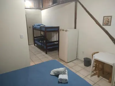 Uma cama ou camas num quarto em Pousada Martin Pescador Bombinhas