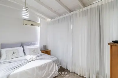 Uma cama ou camas num quarto em Sobrado Bela Vista c/Churrasq em Bombinhas AGS0642
