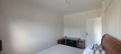 Uma cama ou camas num quarto em Casa com piscina A 250 METROS DA PRAIA de Canto Grande BOMBINHAS