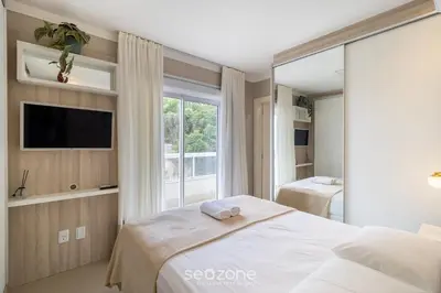 Uma cama ou camas num quarto em Apto Vista Mar c/ churrasq em Bombinhas ARN0104