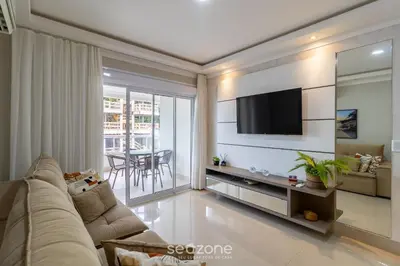 Uma televisão e/ou sistema de entretenimento em Apto Vista Mar c/ churrasq em Bombinhas ARN0104