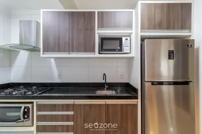 A cozinha ou kitchenette de Apto Vista Mar c/ churrasq em Bombinhas ARN0104