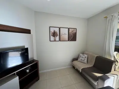 Uma televisão e/ou sistema de entretenimento em Salema 202 - apartamento 02 dormitórios