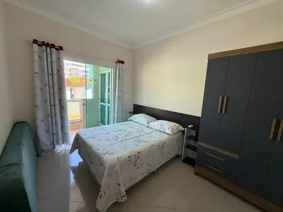 Uma cama ou camas num quarto em A26 - APARTAMENTO 2 DORMITÓRIOS NO CENTRO DE BOMBINHAS