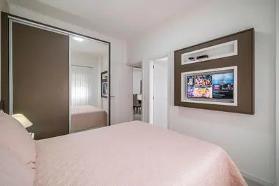 Uma cama ou camas num quarto em A05 - 101 bl 02 - Águas Azuis - Apartamento na Avenida de Bombinhas