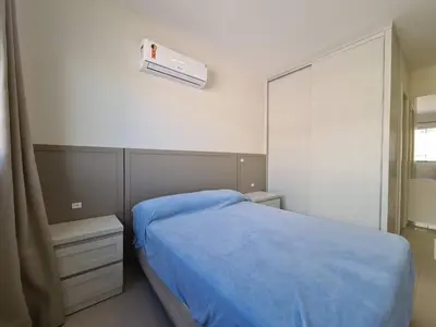 Uma cama ou camas num quarto em A50 - Montese 301 - Apartamento para 08 pessoas - 03 dormitórios