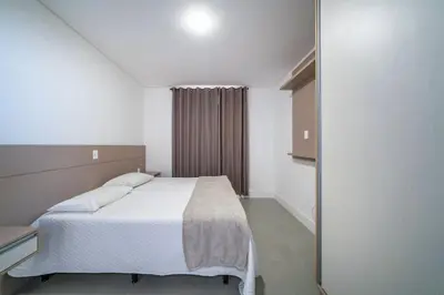 Uma cama ou camas num quarto em A103 - Residencial Badejo