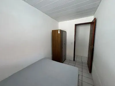 Uma cama ou camas num quarto em A86 - Casa 02 dormitórios no centro.