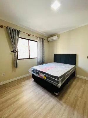 Uma cama ou camas num quarto em APARTAMENTO EM MEIA PRAIA ITAPEMA 3 QUARTOs