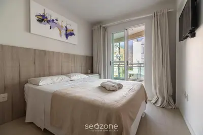 Uma cama ou camas num quarto em RFO - Apartamentos a poucos passos da Praia de Bombinhas