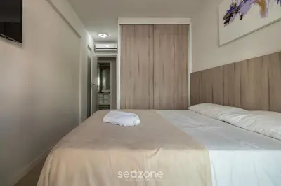 Uma cama ou camas num quarto em RFO - Apartamentos a poucos passos da Praia de Bombinhas