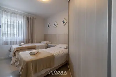 Uma cama ou camas num quarto em RFO - Apartamentos a poucos passos da Praia de Bombinhas